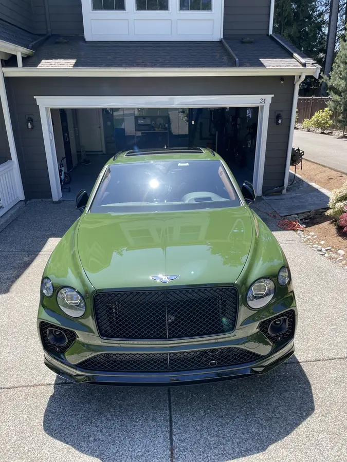 Green Bentley Bentayga gleaming after a full detail